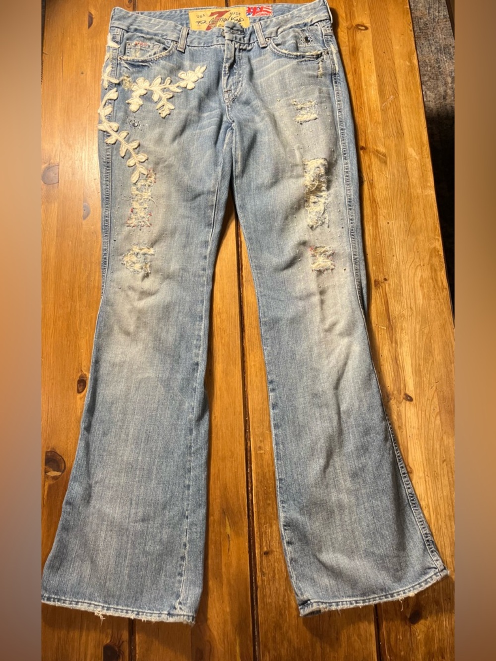 7 For All Mankind Light Blue Embroidered Flare Jeans. inseam is 33 inches.